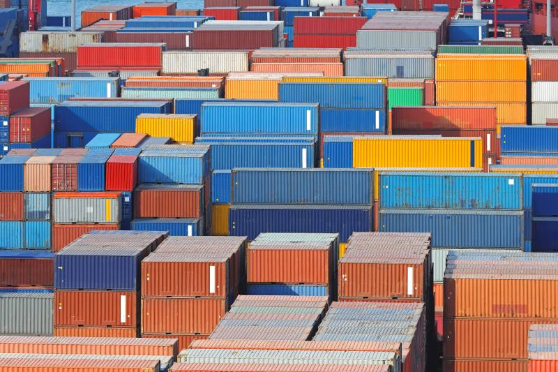 An aerial view of intermodal containers in a port.